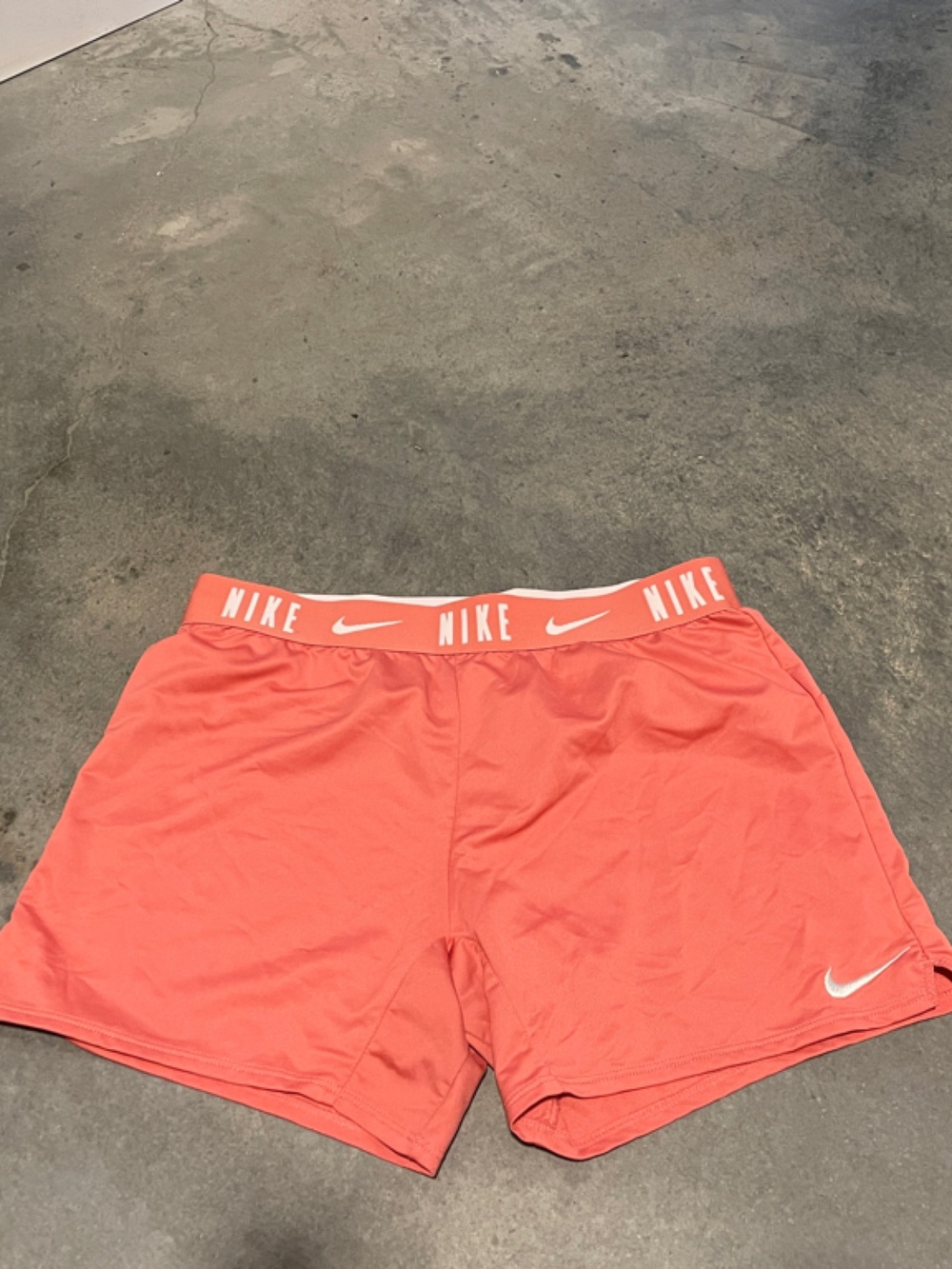 Nike coral/peach gym shorts, fit tight like a bike short, elastic waist